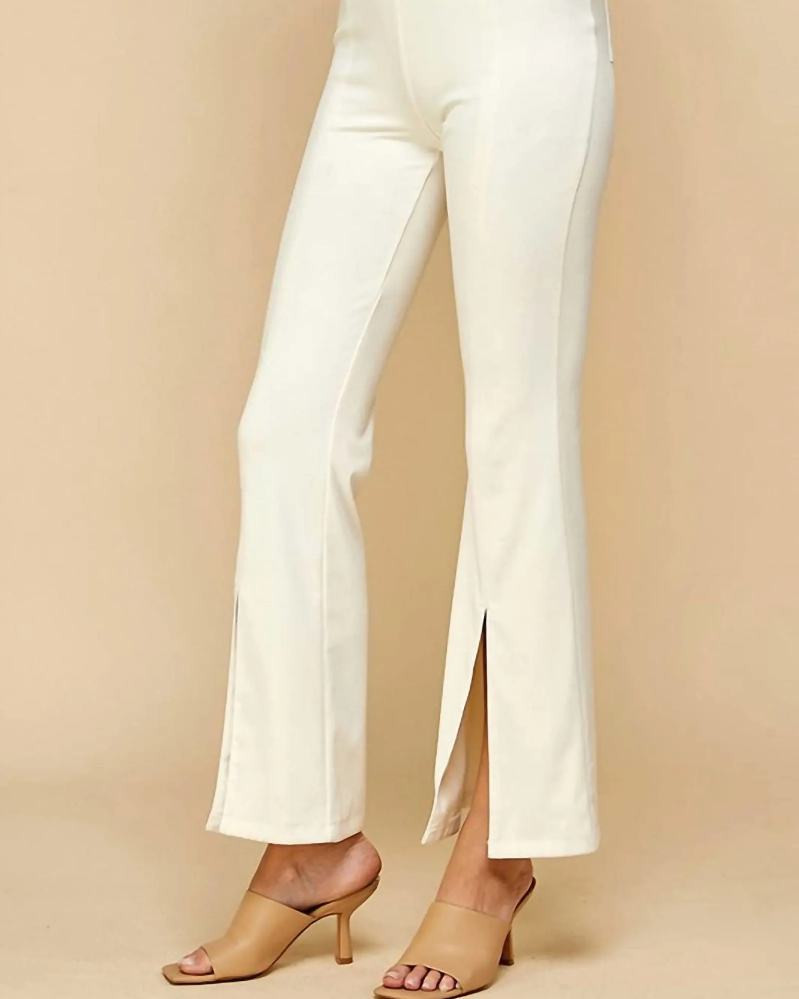 Split The Difference Front Slit Flared Pants In White | White